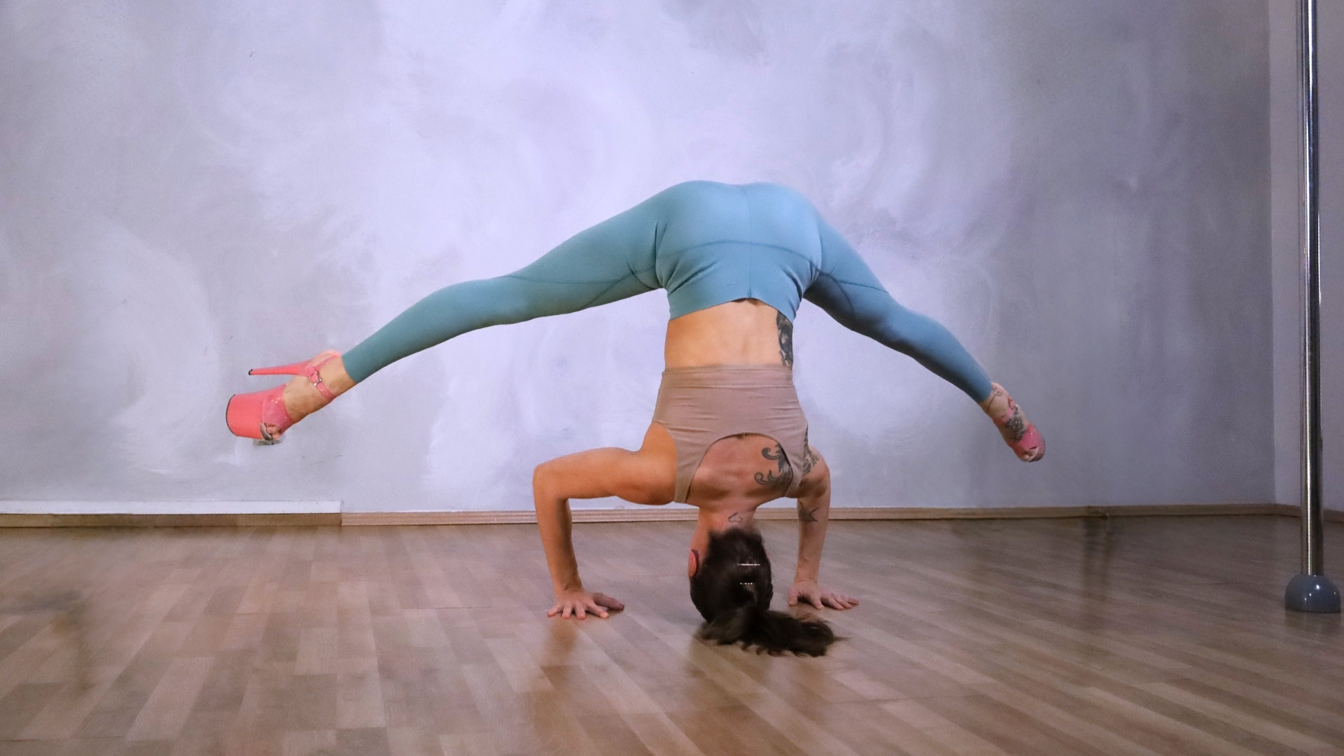 Headstand with pole and on the floor